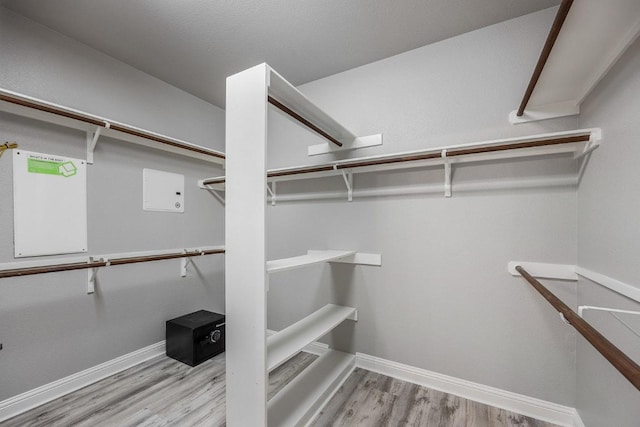 spacious closet with wood finished floors
