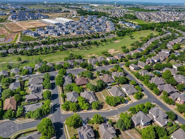 birds eye view of property with a residential view and view of golf course