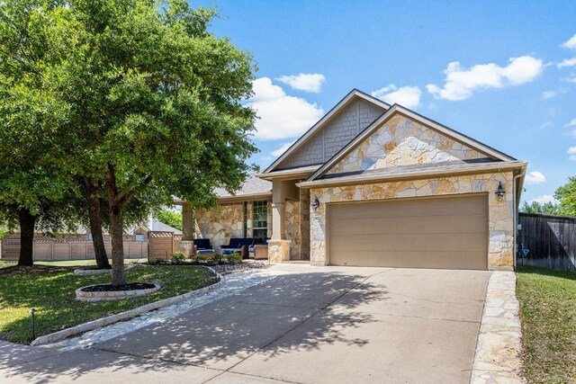 902 Fork Ridge Path, Round Rock, TX 78665 - view of front of property with stone siding, driveway, and a garage