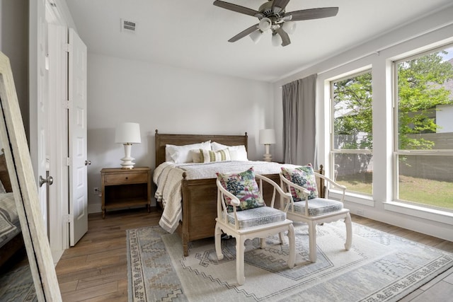 229 S Park Vis, Georgetown, TX 78628 - bedroom with light wood-style flooring and ceiling fan