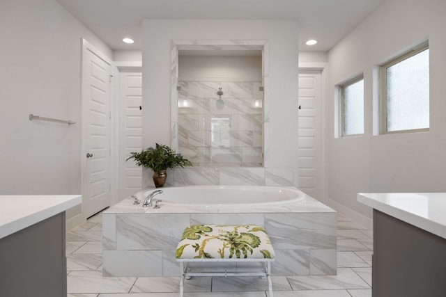 229 S Park Vis, Georgetown, TX 78628 - full bathroom featuring vanity, a garden tub, baseboards, recessed lighting, and tiled shower