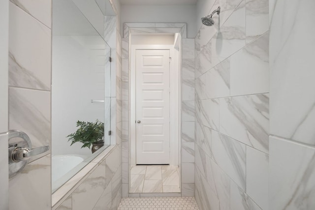bathroom featuring a tile shower, tile patterned flooring, a bathtub, and tile walls