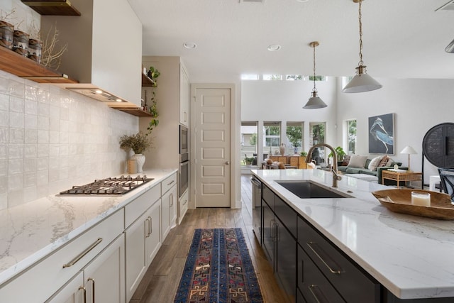 229 S Park Vis, Georgetown, TX 78628 - kitchen featuring stainless steel appliances, a sink, open shelves, open floor plan, and white cabinets