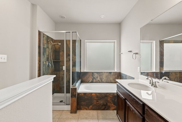 full bath featuring a bath, tile patterned floors, vanity, and a shower stall