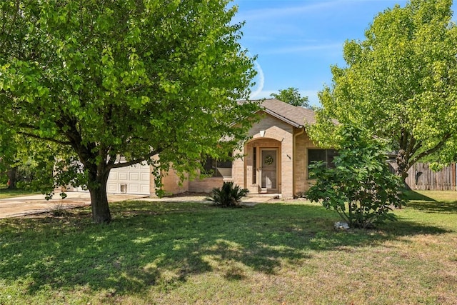 171 Calle Largo, Kyle, TX 78640 - obstructed view of property with an attached garage, fence, driveway, and a front yard