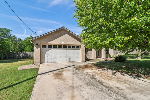 171 Calle Largo, Kyle, TX 78640 - view of front of property featuring driveway, a front yard, a garage, brick siding, and fence