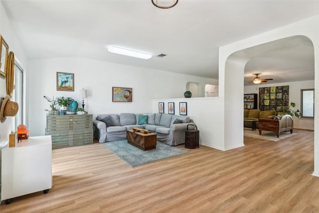 171 Calle Largo, Kyle, TX 78640 - living room with light wood-type flooring, a ceiling fan, arched walkways, and vaulted ceiling