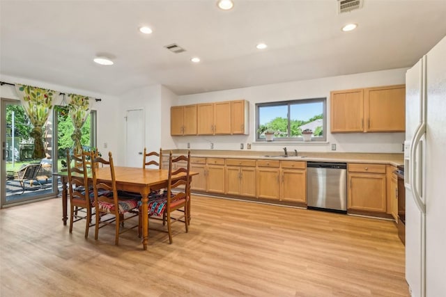 171 Calle Largo, Kyle, TX 78640 - kitchen featuring a sink, light wood finished floors, dishwasher, light countertops, and visible vents