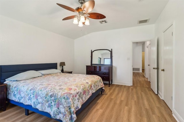 171 Calle Largo, Kyle, TX 78640 - bedroom with lofted ceiling, light wood finished floors, and visible vents