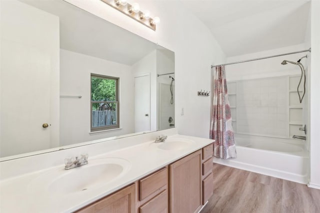 171 Calle Largo, Kyle, TX 78640 - full bathroom with double vanity, shower / tub combo with curtain, and wood finished floors