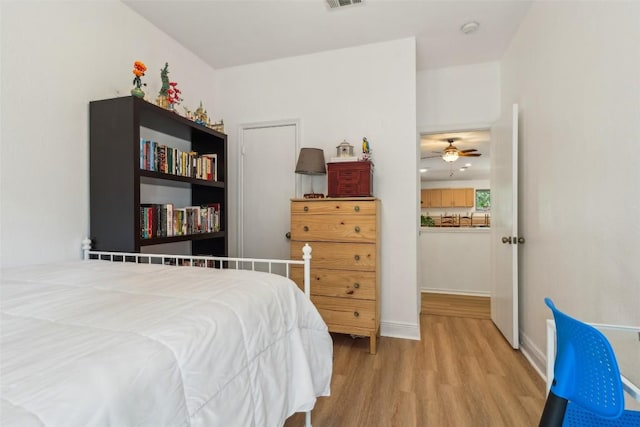 171 Calle Largo, Kyle, TX 78640 - bedroom with visible vents, baseboards, and wood finished floors