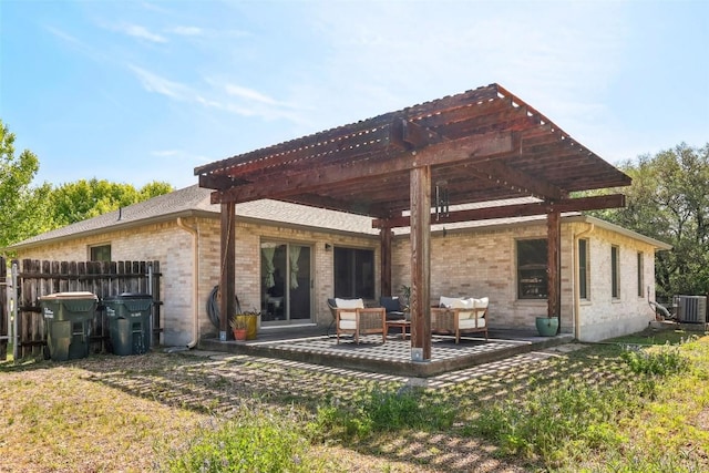 171 Calle Largo, Kyle, TX 78640 - rear view of property with fence, a pergola, brick siding, an outdoor hangout area, and central AC unit