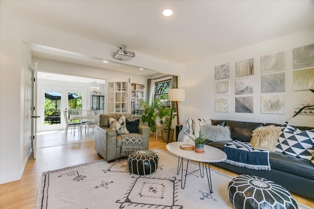 living room with wood finished floors and recessed lighting