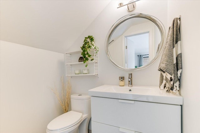 6003 Merriwood Dr, Austin, TX 78745 - bathroom featuring vanity, vaulted ceiling, and toilet