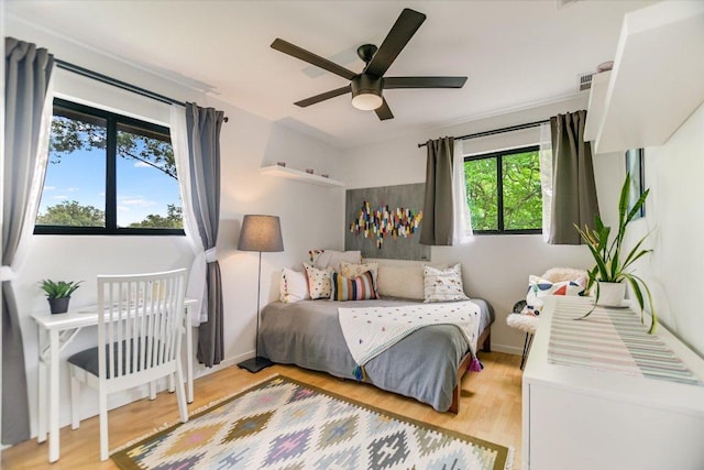 6003 Merriwood Dr, Austin, TX 78745 - bedroom featuring light wood-type flooring and ceiling fan