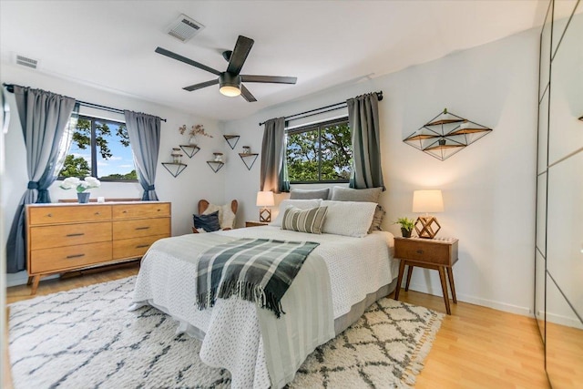 6003 Merriwood Dr, Austin, TX 78745 - bedroom featuring light wood-type flooring, baseboards, and a ceiling fan