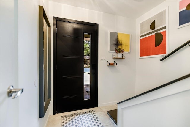 6003 Merriwood Dr, Austin, TX 78745 - foyer entrance featuring light tile patterned floors and baseboards