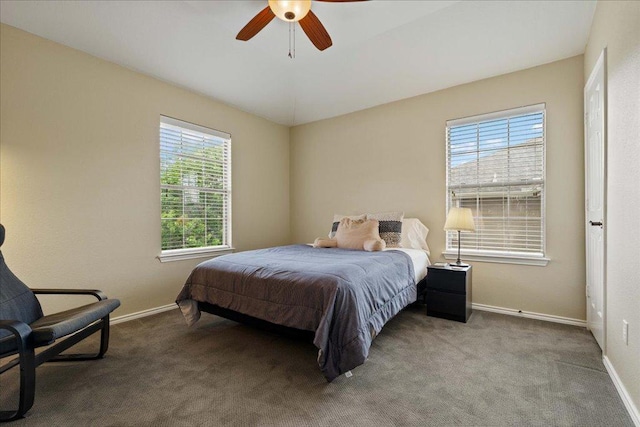 carpeted bedroom with baseboards and ceiling fan