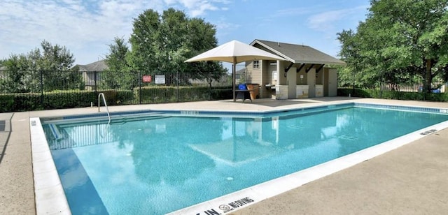 community pool featuring fence