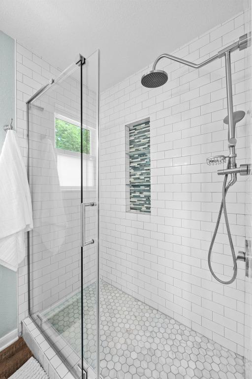 bathroom with a stall shower