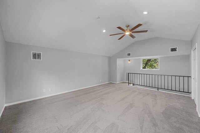 additional living space featuring a ceiling fan, visible vents, carpet, and vaulted ceiling