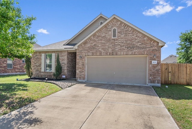 ranch-style house with brick siding, fence, driveway, and a garage