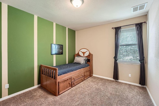 bedroom featuring light colored carpet, baseboards, and visible vents