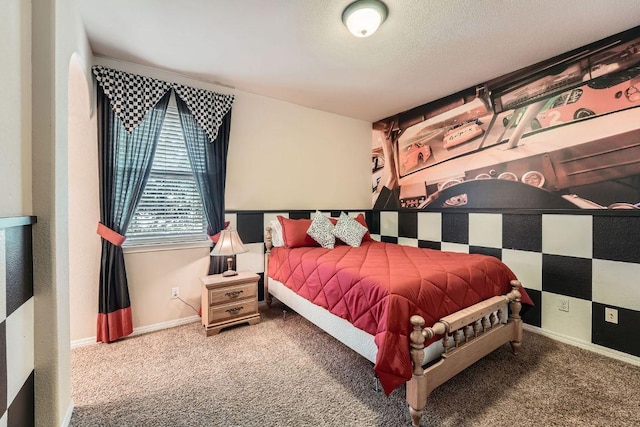 bedroom with baseboards and carpet