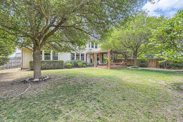 view of yard featuring a pergola, a fenced backyard, and a deck
