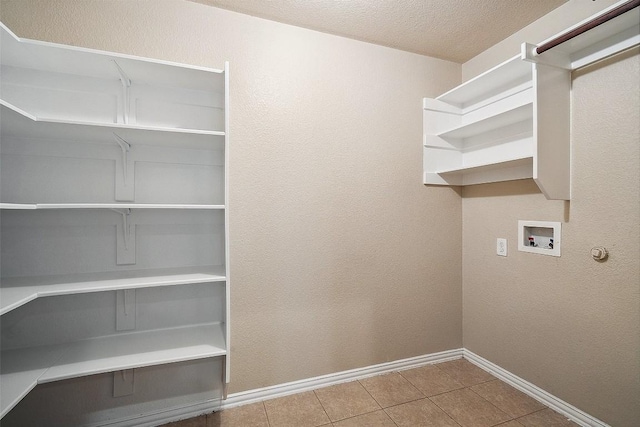 1124 Dyer Creek Pl, Round Rock, TX 78665 - laundry room featuring baseboards, hookup for a washing machine, tile patterned flooring, and a textured ceiling