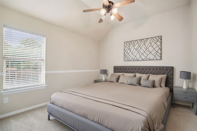 bedroom with baseboards, a ceiling fan, lofted ceiling, and light colored carpet