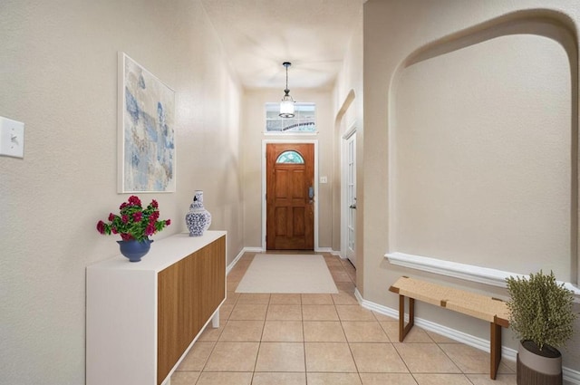 1124 Dyer Creek Pl, Round Rock, TX 78665 - entryway featuring light tile patterned floors, arched walkways, and baseboards