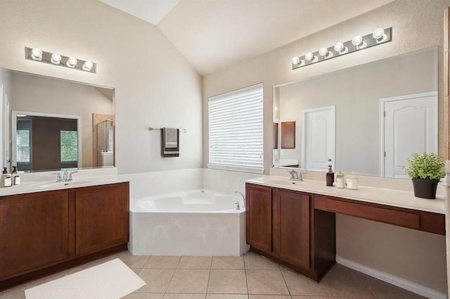 1124 Dyer Creek Pl, Round Rock, TX 78665 - full bath with tile patterned floors, a garden tub, lofted ceiling, two vanities, and a stall shower