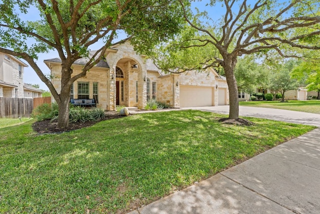 10033 Lisi Anne Dr, Austin, TX 78717 - view of front of house featuring stone siding, driveway, and a garage