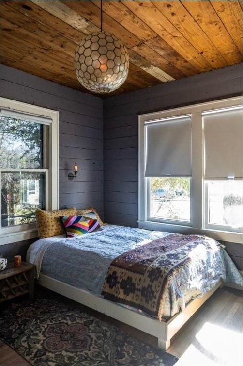 712 Harris Ave Unit 1, Austin, TX 78705 - bedroom with wooden ceiling, multiple windows, wood finished floors, and wooden walls