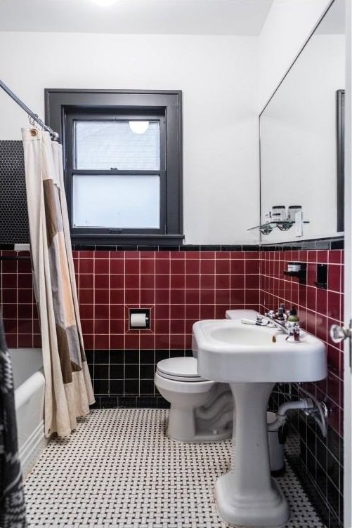 712 Harris Ave Unit 1, Austin, TX 78705 - full bath with tile walls, wainscoting, shower / bath combo, and tile patterned floors