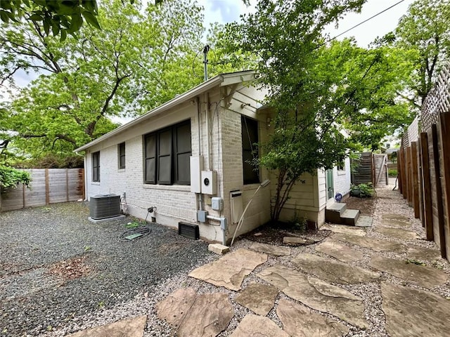 712 Harris Ave Unit 1, Austin, TX 78705 - view of side of home featuring brick siding, a fenced backyard, and entry steps