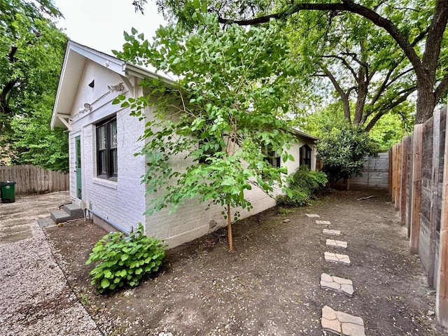712 Harris Ave Unit 1, Austin, TX 78705 - view of property exterior with a fenced backyard and brick siding