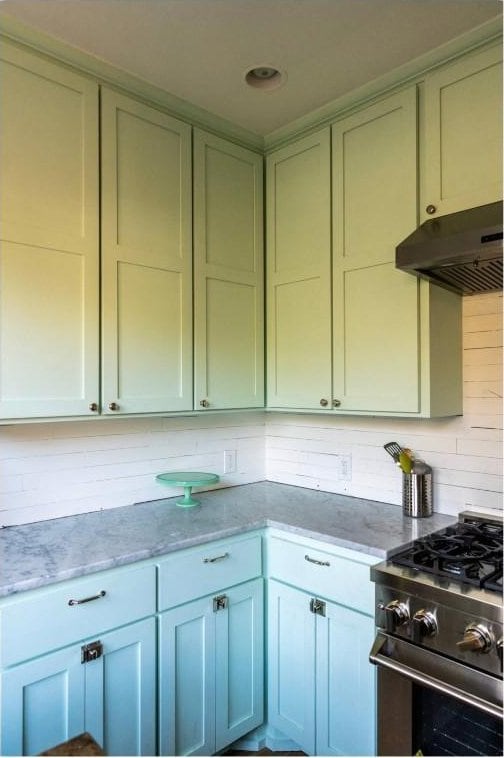 712 Harris Ave Unit 1, Austin, TX 78705 - kitchen featuring gas range, under cabinet range hood, and light stone counters