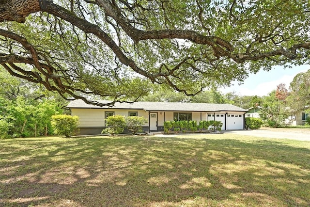 7611 Oak Hedge Pl, Austin, TX 78745 - ranch-style house with a garage, driveway, and a front yard