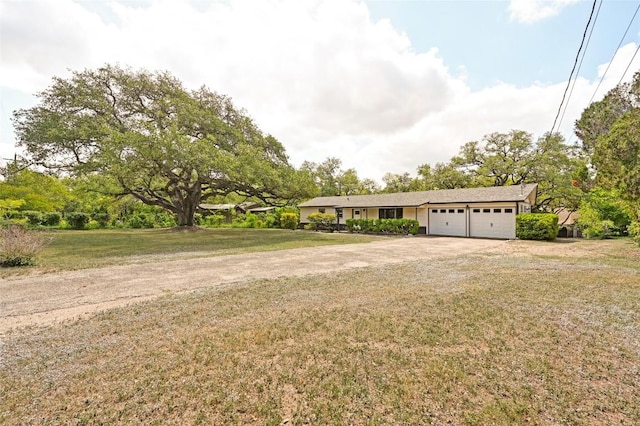 7611 Oak Hedge Pl, Austin, TX 78745 - single story home featuring an attached garage, driveway, and a front lawn