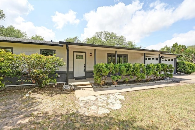 7611 Oak Hedge Pl, Austin, TX 78745 - single story home with an attached garage, covered porch, concrete driveway, and a front lawn