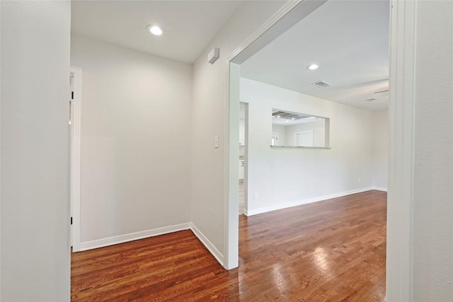 7611 Oak Hedge Pl, Austin, TX 78745 - hallway featuring wood finished floors, recessed lighting, and baseboards