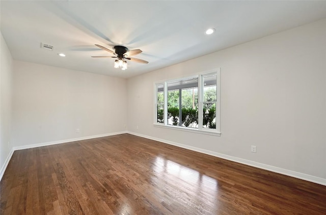 7611 Oak Hedge Pl, Austin, TX 78745 - empty room with ceiling fan, baseboards, dark wood finished floors, and recessed lighting