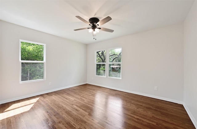 7611 Oak Hedge Pl, Austin, TX 78745 - spare room featuring wood finished floors, baseboards, and ceiling fan
