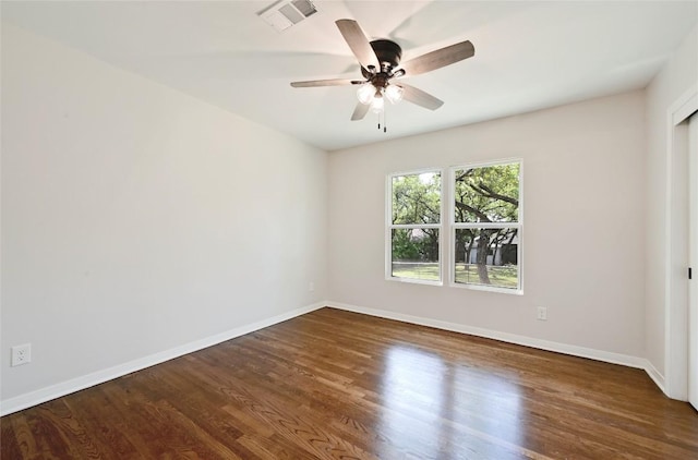 7611 Oak Hedge Pl, Austin, TX 78745 - empty room featuring ceiling fan, wood finished floors, and baseboards