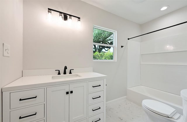 7611 Oak Hedge Pl, Austin, TX 78745 - bathroom featuring toilet, vanity, bathtub / shower combination, and baseboards