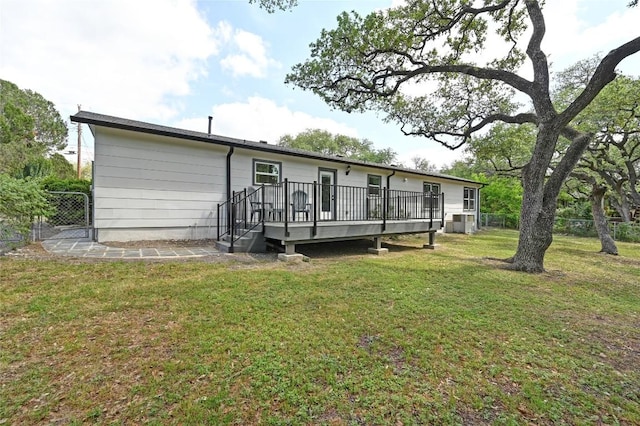 7611 Oak Hedge Pl, Austin, TX 78745 - back of property with a deck and central AC unit
