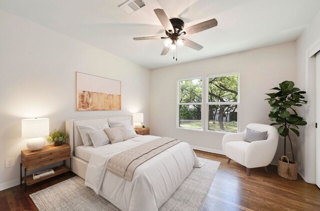 7611 Oak Hedge Pl, Austin, TX 78745 - bedroom featuring wood finished floors, baseboards, and a ceiling fan