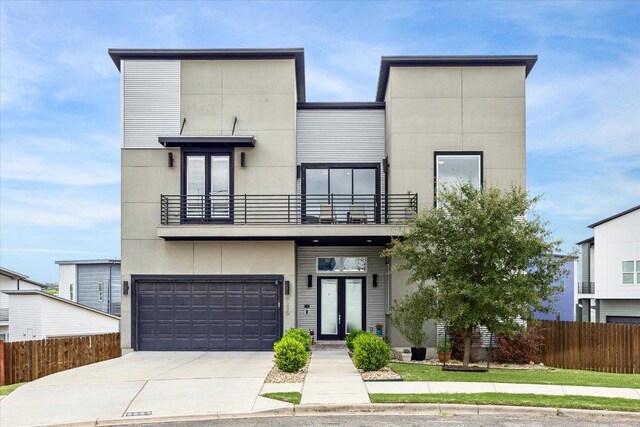 6229 Florencia Ln, Austin, TX 78724 - contemporary home with a balcony, a garage, and driveway